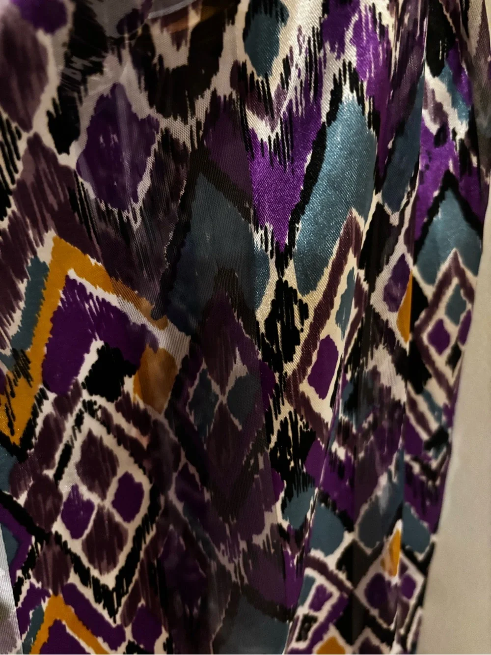 satin scarf featuring a vibrant purple and teal abstract ikat chevron